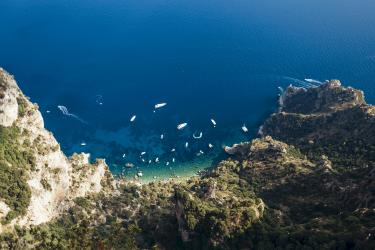 Amalfi Coast -aerial-view-of-boats-moving-on-sea-by-mountain
